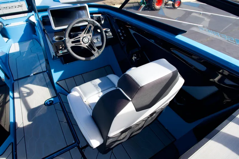 Slide: The Image of 2023 Yamaha Boats 255XD cockpit with modern steering and seating design. - 24