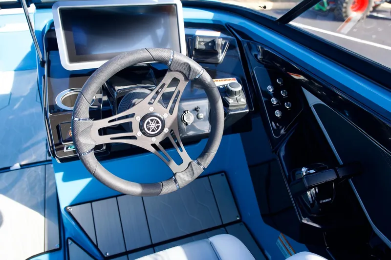 Slide: The Image of 2023 Yamaha Boats 255XD steering console with modern controls and sleek design. - 5