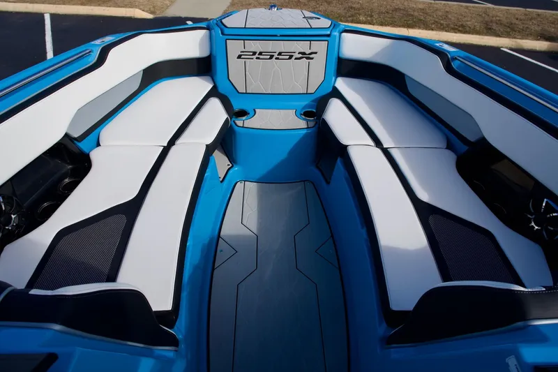 Slide: The Image of 2023 Yamaha Boats 255XD interior with blue and white seating, modern design. - 8