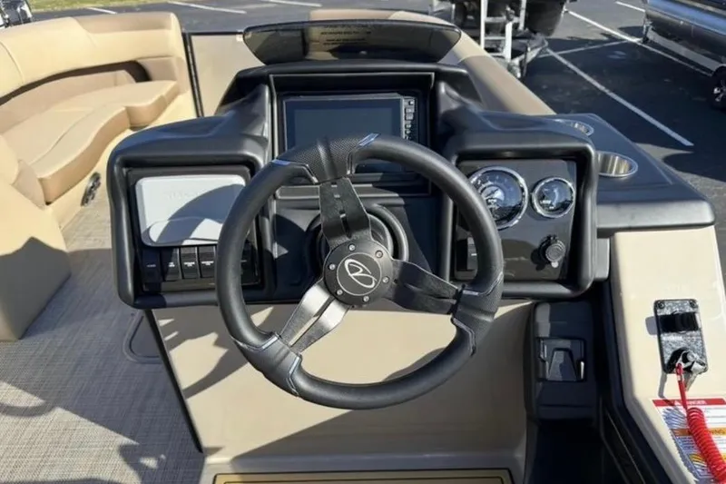 Slide: The Image of 2025 Veranda VR25RC XL boat dashboard with steering wheel and gauges. - 4