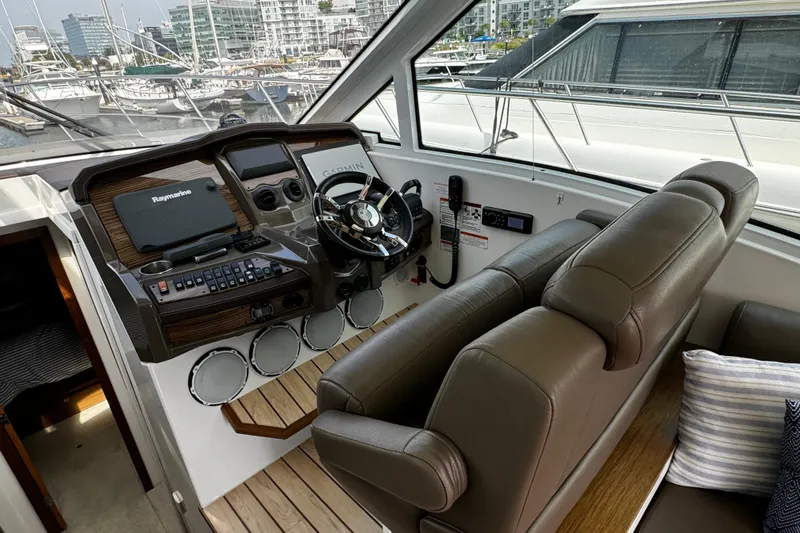 Slide: The Image of Interior helm of 2014 Cruisers Yachts 45 Cantius with modern navigation equipment. - 13