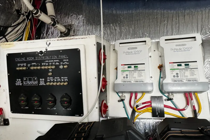 Slide: The Image of Engine room distribution panel and ProNautic chargers on 2014 Cruisers Yachts 45 Cantius. - 27