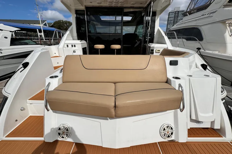 Slide: The Image of 2014 Cruisers Yachts 45 Cantius with tan seating and modern deck design. - 3