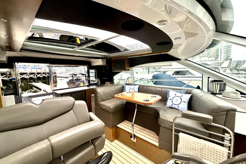 Slide: The Image of Luxurious interior of 2014 Cruisers Yachts 45 Cantius with leather seating and panoramic windows. - 11