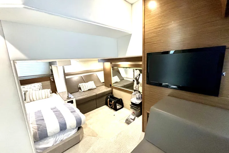 Slide: The Image of Luxurious interior of 2014 Cruisers Yachts 45 Cantius with modern furnishings and TV. - 16