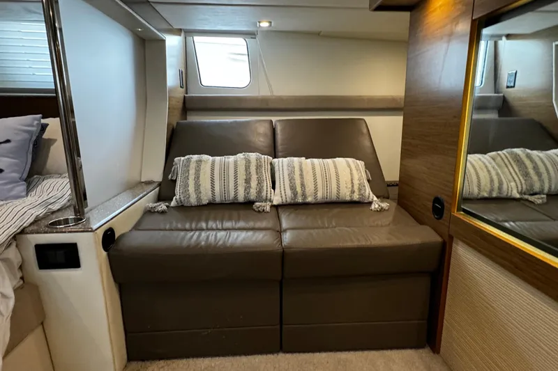 Slide: The Image of 2014 Cruisers Yachts 45 Cantius interior with leather seating and decorative pillows. - 17