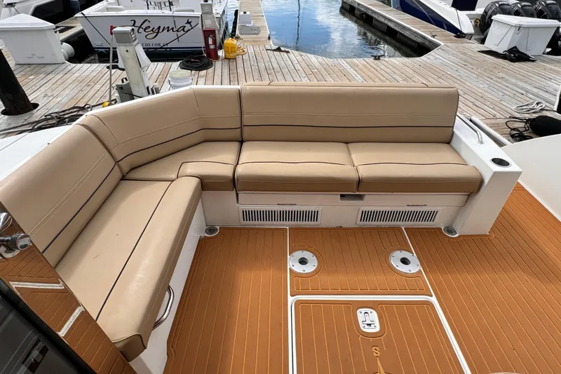 Slide: The Image of Luxurious seating on 2014 Cruisers Yachts 45 Cantius, docked with teak flooring. - 7
