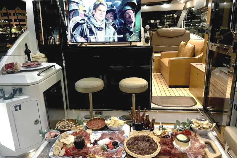 Slide: The Image of Luxurious 2014 Cruisers Yachts 45 Cantius with gourmet spread and TV entertainment onboard. - 8