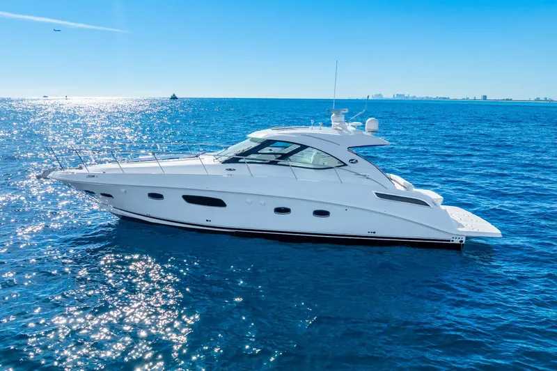 Slide: The Image of 2009 Sea Ray 470 Sundancer yacht cruising on a sunny ocean. - 2