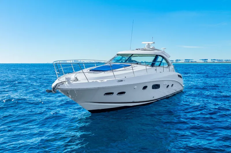Slide: The Image of 2009 Sea Ray 470 Sundancer yacht cruising on open blue ocean. - 3