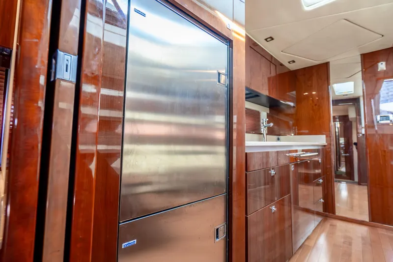 Slide: The Image of Luxurious 2009 Sea Ray 470 Sundancer yacht interior with sleek kitchen cabinetry. - 30