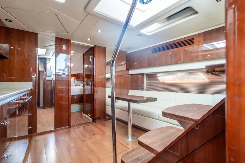 Slide: The Image of Luxurious interior of 2009 Sea Ray 470 Sundancer yacht with wood finishes and modern seating. - 31