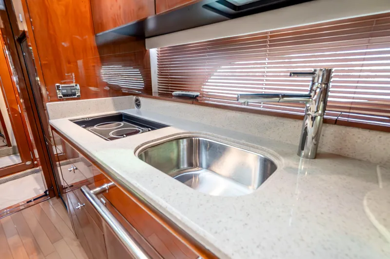 Slide: The Image of Luxurious kitchen area in 2009 Sea Ray 470 Sundancer yacht with modern fixtures. - 35
