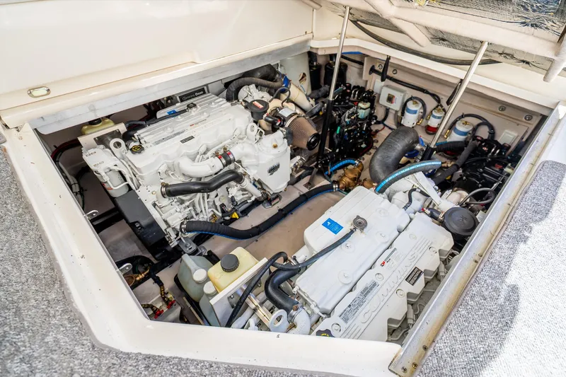 Slide: The Image of Engine compartment of a 2009 Sea Ray 470 Sundancer, featuring dual Cummins engines. - 44