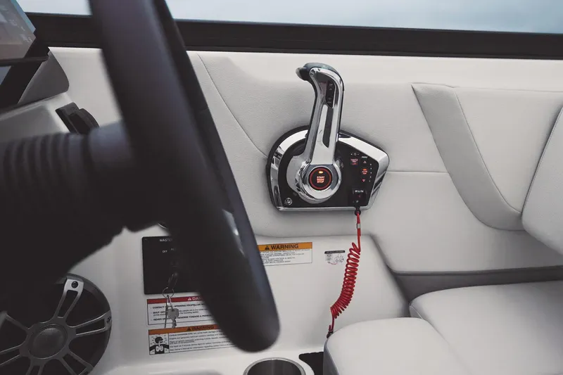 Slide: The Image of Manufacturer Provided Image: 2024 Sea Ray SDX 270 boat throttle control and steering wheel. - 11