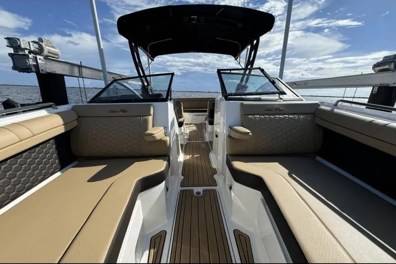 Slide: The Image of 2024 Sea Ray SDX 270 boat cockpit with Simrad navigation, luxurious seating, and sleek design. - 12