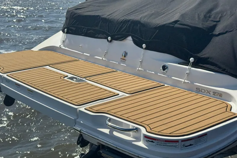 Slide: The Image of 2024 Sea Ray SDX 270 interior with speaker and sleek design elements. - 19