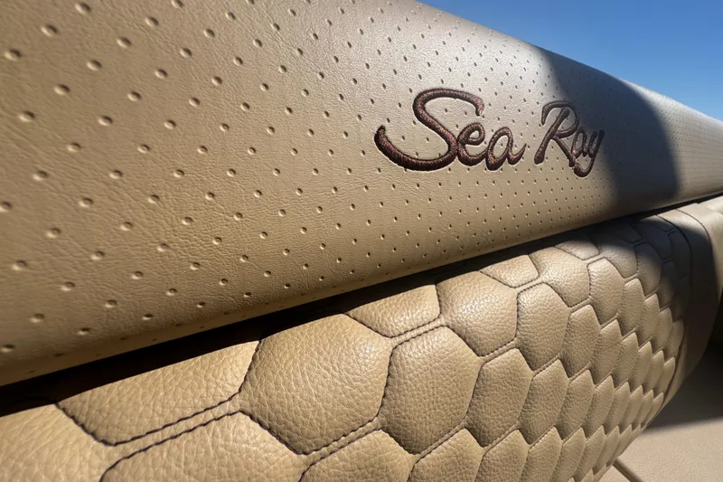 Slide: The Image of 2024 Sea Ray SDX 270 interior with embossed logo and textured leather upholstery. - 27
