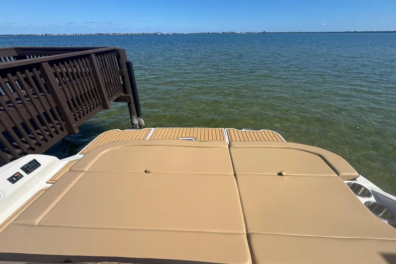 Slide: The Image of 2024 Sea Ray SDX 270 boat with spacious deck by the water. - 28