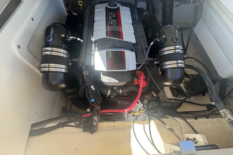 Slide: The Image of 2024 Sea Ray SDX 270 engine compartment showcasing powerful 6.2L engine. - 32