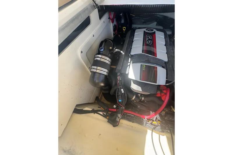 Slide: The Image of 2024 Sea Ray SDX 270 engine compartment showcasing a powerful 6.2L engine. - 33