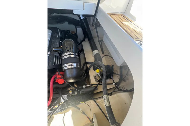 Slide: The Image of Engine compartment of 2024 Sea Ray SDX 270 boat, showcasing mechanical components. - 34