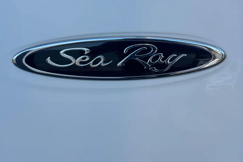 Slide: The Image of 2024 Sea Ray SDX 270 logo on a sleek white surface. - 38