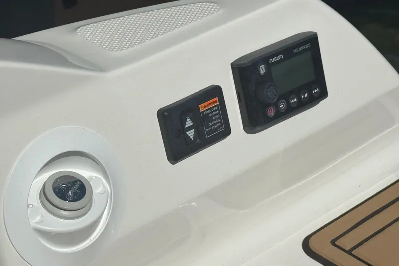 Slide: The Image of 2024 Sea Ray SDX 270 dashboard with control panel and speaker. - 43