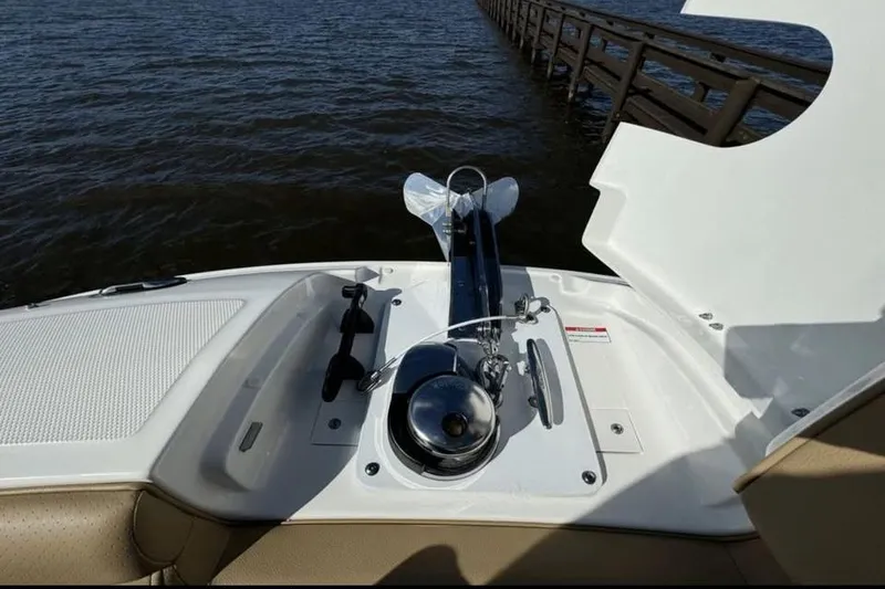 Slide: The Image of 2024 Sea Ray SDX 270 boat interior with tan seating and open deck view. - 9