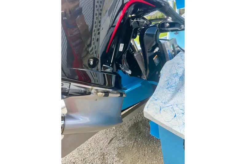 Slide: The Image of Close-up of a 2022 Flats Cat 21' boat motor and transom detail. - 9