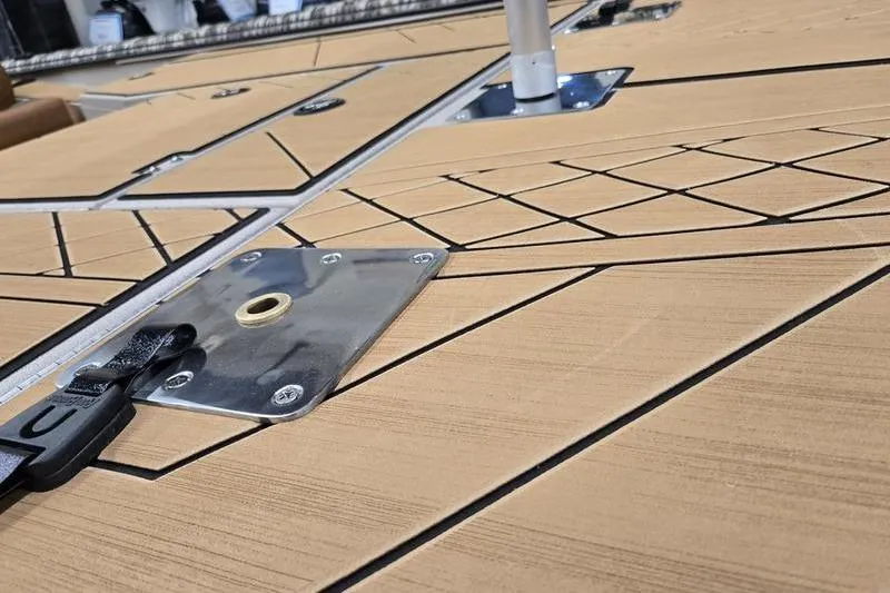 Slide: The Image of Deck of 2026 Avid 18 Vertex boat with sleek design and metal fixtures. - 12