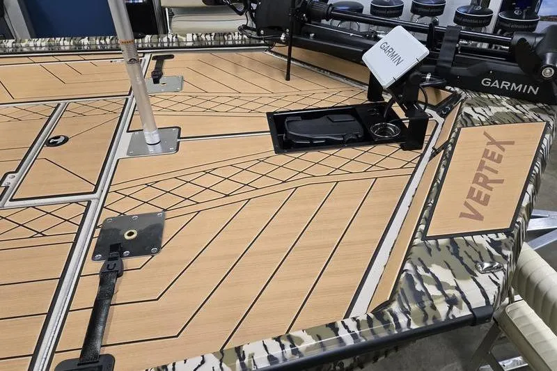 Slide: The Image of Avid 18 Vertex 2026 boat deck with Garmin equipment and camo design. - 14