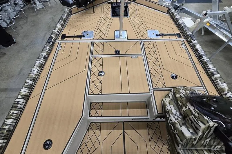 Slide: The Image of 2026 Avid 18 Vertex boat deck with camo trim and storage compartments. - 18