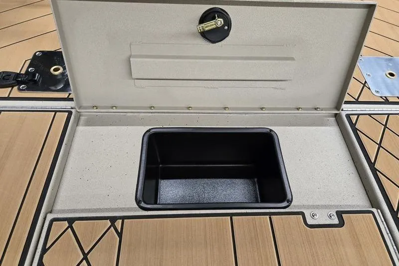 Slide: The Image of Open storage compartment on 2026 Avid 18 Vertex boat deck. - 22