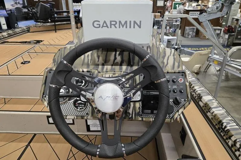 Slide: The Image of Steering wheel of 2026 Avid 18 Vertex boat with Garmin navigation system. - 6