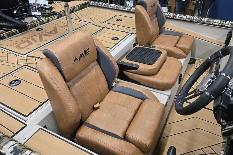 Slide: The Image of 2026 Avid 18 Vertex boat interior with tan leather seats and modern design. - 9