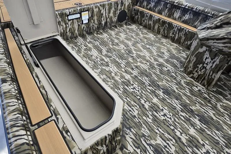 Slide: The Image of Camouflage interior of 2026 Avid 20 Rogue SC boat with storage compartment. - 10