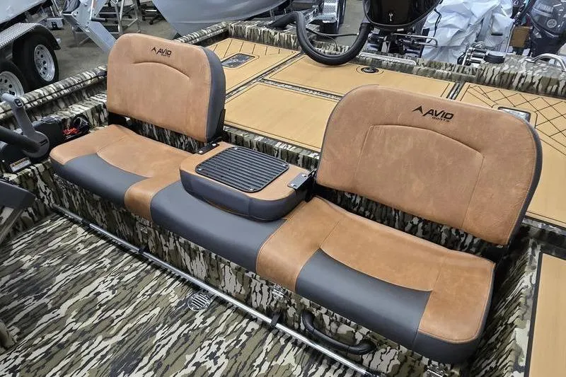 Slide: The Image of Avid 20 Rogue SC 2026 boat interior with camo design and cushioned seating. - 6