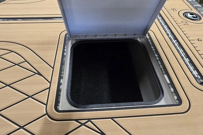 Slide: The Image of Open storage compartment on 2026 Avid 20 Rogue SC boat deck. - 8