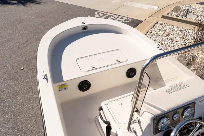 Slide: The Image of 2026 Carolina Skiff E18 JVX CC boat interior with console and storage compartments. - 10