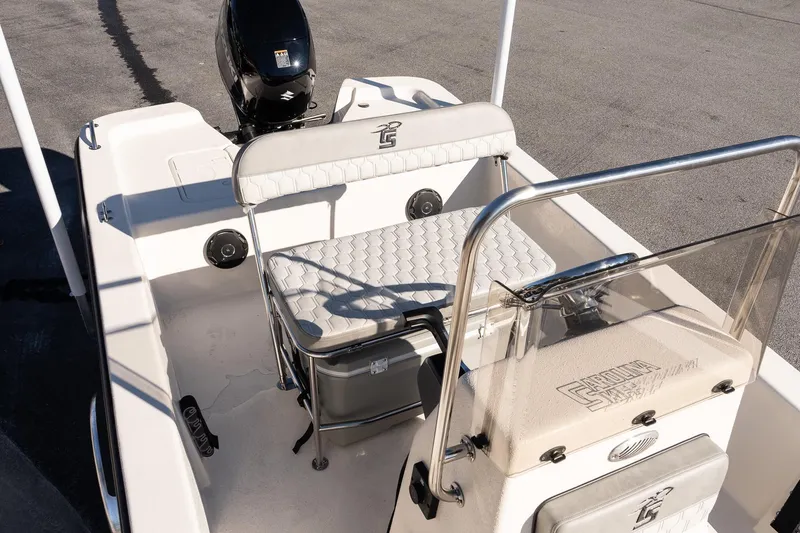 Slide: The Image of 2026 Carolina Skiff E18 JVX CC boat interior with seating and console. - 11