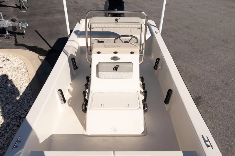 Slide: The Image of 2026 Carolina Skiff E18 JVX CC boat interior with steering console and seating. - 12