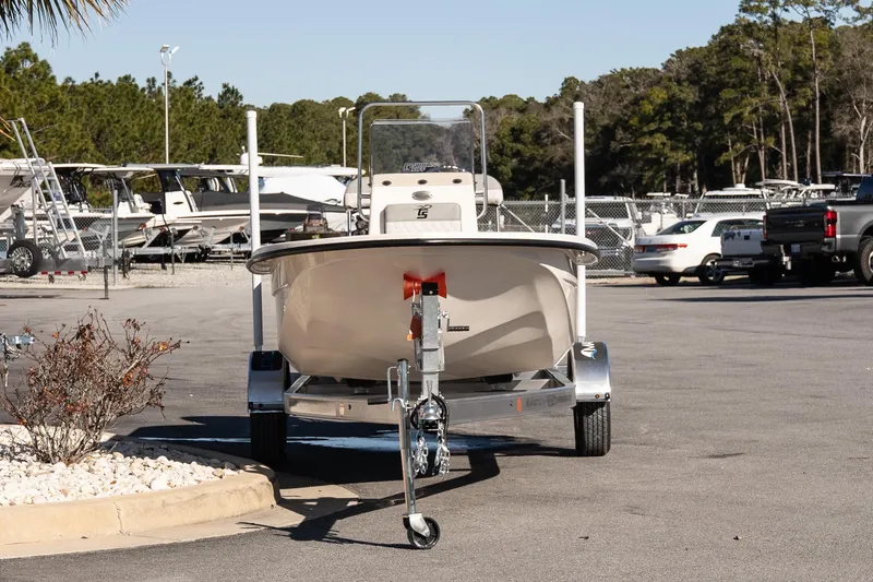 Slide: The Image of 2026 Carolina Skiff E18 JVX CC boat on trailer in parking lot. - 3