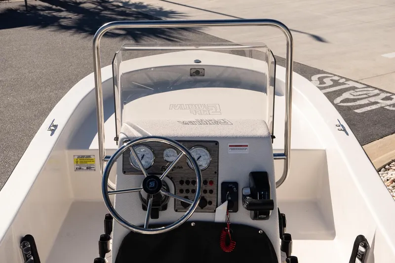 Slide: The Image of 2026 Carolina Skiff E18 JVX CC boat console with steering wheel and gauges. - 9