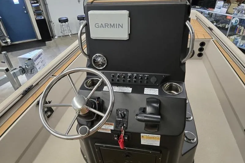 Slide: The Image of Steering console of 2026 Avid 22 Rogue CC boat with Garmin navigation system. - 4
