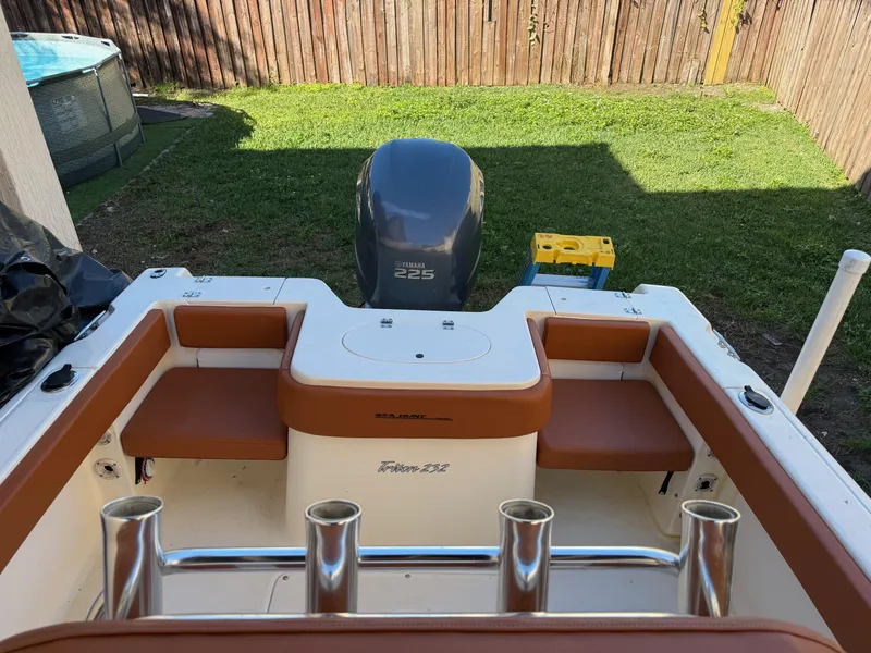 Slide: The Image of 2005 Sea Hunt Triton 232 boat with Yamaha 225 engine in backyard setting. - 21