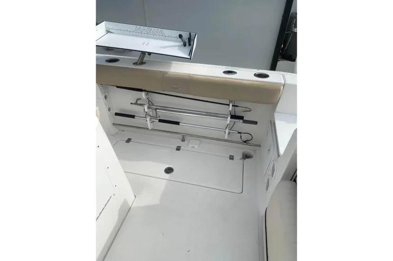 Slide: The Image of 2016 Sea Fox 286 Commander boat interior with fishing rod holders and storage area. - 10