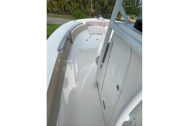 Slide: The Image of 2016 Sea Fox 286 Commander boat interior with sleek white design and spacious seating. - 7