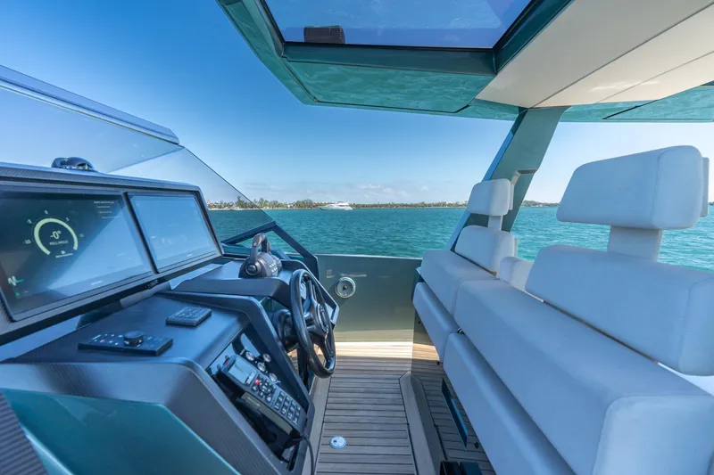 Slide: The Image of Interior view of 2021 Wally 48 Wally Tender yacht with modern dashboard and seating. - 24