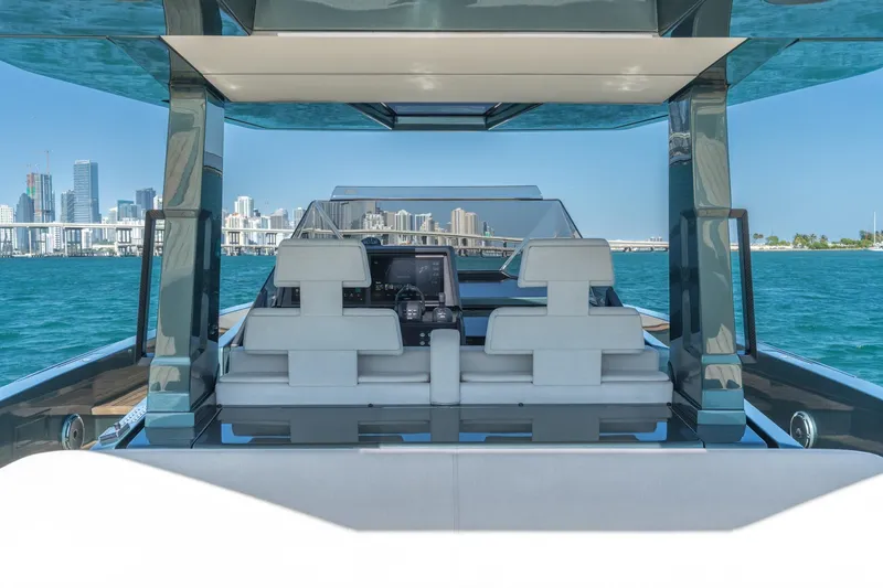 Slide: The Image of 2021 Wally 48 Wally Tender yacht with city skyline in the background. - 27